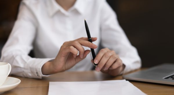 front-view-businessman-holding-pen